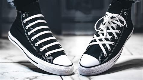 lacing converse high tops.